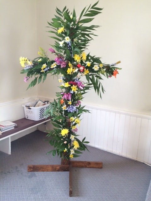 Easter blooming cross decorated with colorful flowers inside Salem Presbyterian Church