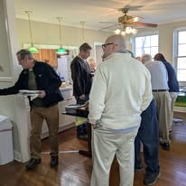 Congregation members gathered around tables in the fellowship hall at Salem Presbyterian Church